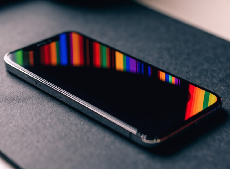A phone screen showing vivid vertical colour bands and a dead black region across the lower half.